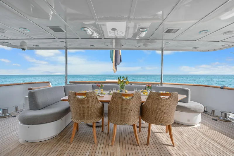 Slide: The Image of Outdoor dining area on a 1993 Christensen Semi Displacement yacht with ocean view. - 1