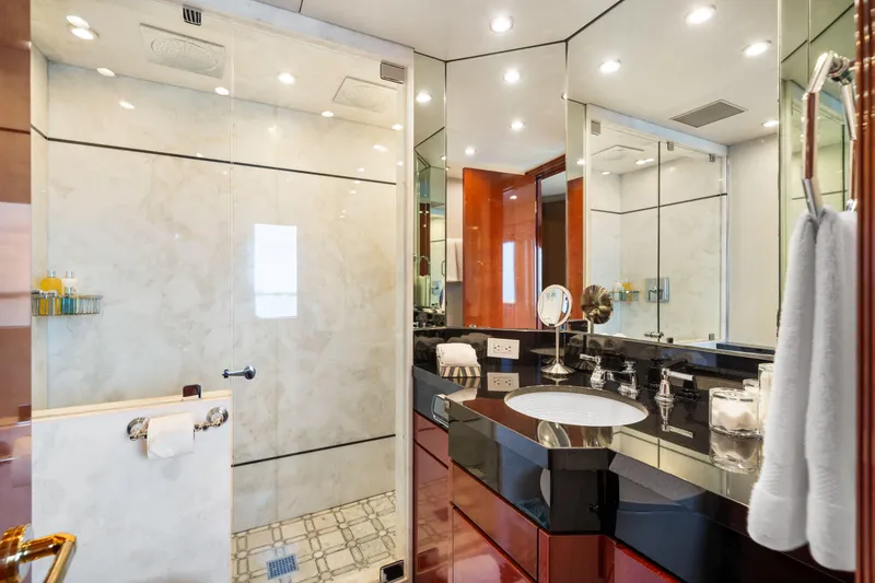 Slide: The Image of Luxurious bathroom on a 1993 Christensen Semi Displacement yacht with modern fixtures and glass shower. - 10