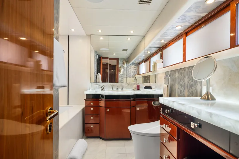 Slide: The Image of Luxurious bathroom in 1993 Christensen Semi Displacement yacht with elegant wood cabinetry. - 12