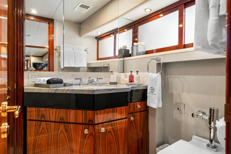 Slide: The Image of Luxurious bathroom in a 1993 Christensen Semi Displacement yacht with elegant wood cabinetry. - 15