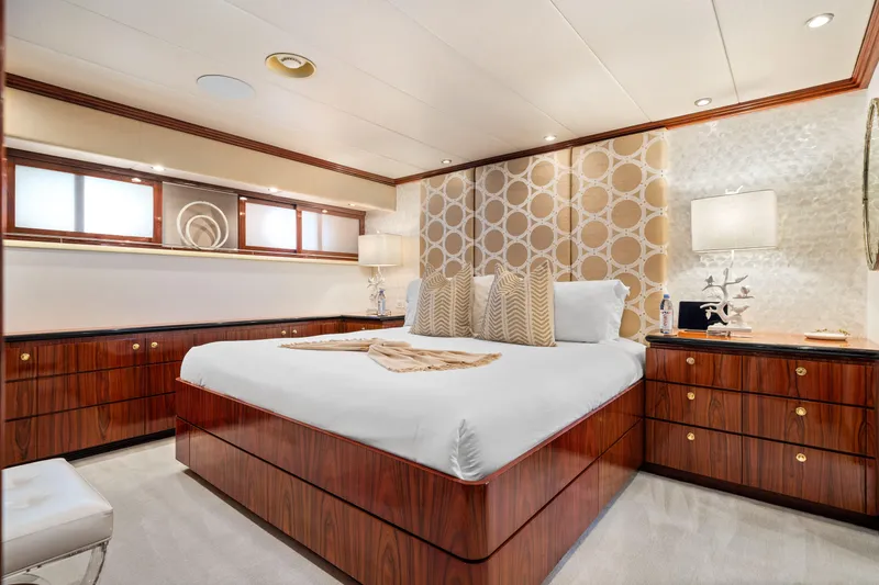 Slide: The Image of Luxurious bedroom on 1993 Christensen Semi Displacement yacht with elegant wood finishes and modern decor. - 16