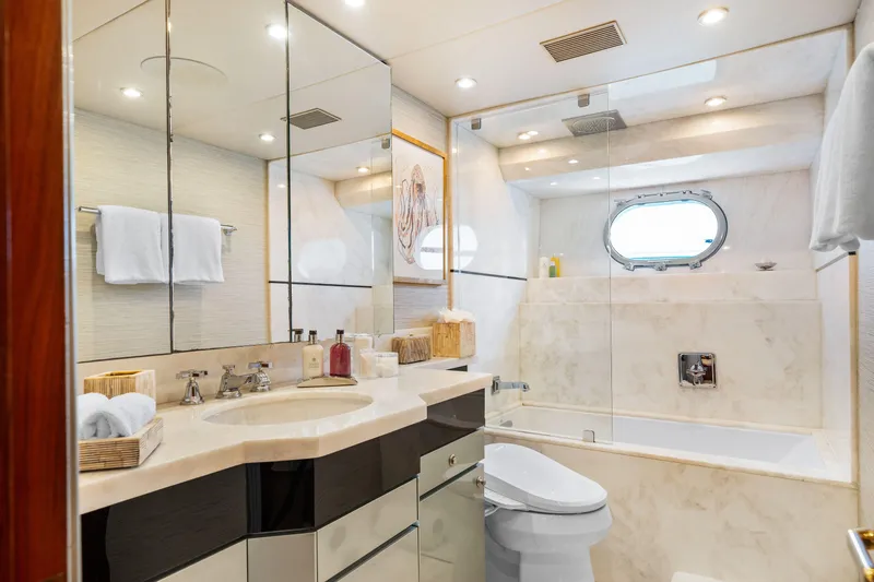Slide: The Image of Luxurious bathroom in a 1993 Christensen Semi Displacement yacht with marble finishes and modern fixtures. - 17