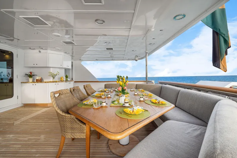 Slide: The Image of Luxurious dining area on 1993 Christensen Semi Displacement yacht with ocean view. - 2