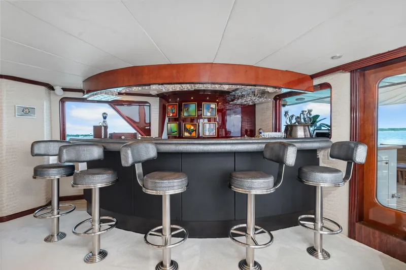 Slide: The Image of Luxurious bar area on a 1993 Christensen Semi Displacement yacht with modern stools. - 21