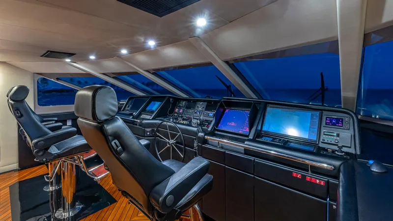 Slide: The Image of 1993 Christensen Semi Displacement yacht helm with modern navigation equipment and leather seats. - 23