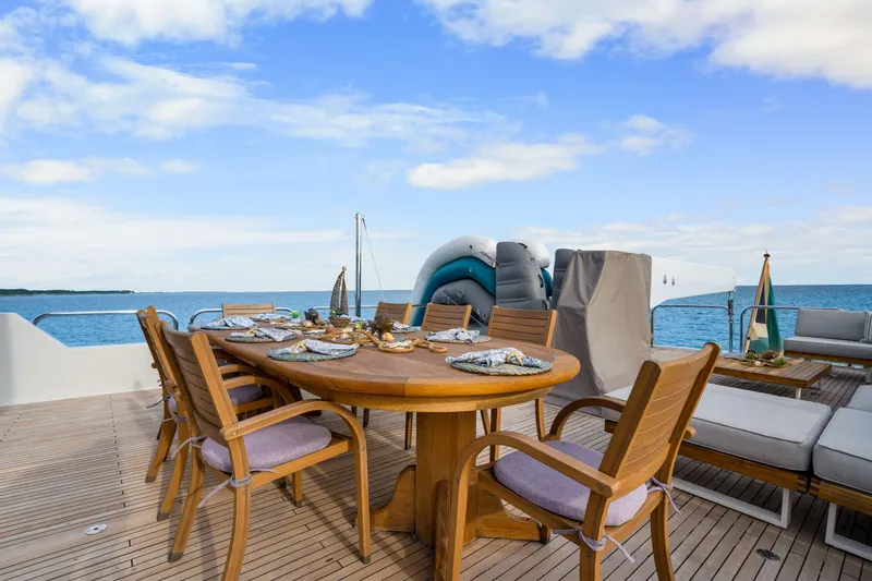 Slide: The Image of Outdoor dining area on 1993 Christensen Semi Displacement yacht with ocean view. - 25