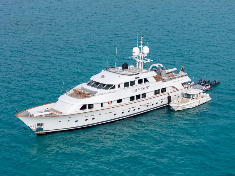 Slide: The Image of 1993 Christensen Semi Displacement yacht Sweet Escape anchored in clear blue waters. - 31