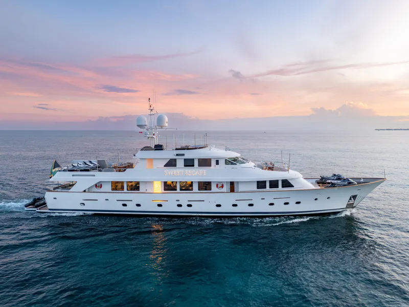 Slide: The Image of Christensen 1993 Semi Displacement yacht cruising at sunset on the ocean. - 32