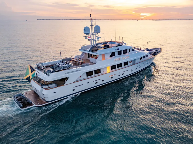 Slide: The Image of Christensen 1993 Semi Displacement yacht cruising at sunset. - 33
