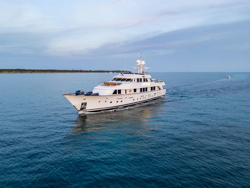 Slide: The Image of Luxury 1993 Christensen Semi Displacement yacht cruising on calm blue waters. - 34