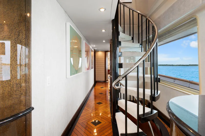 Slide: The Image of Luxurious 1993 Christensen Semi Displacement yacht interior with spiral staircase and ocean view. - 7