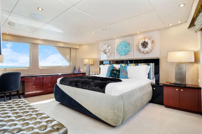 Slide: The Image of Luxurious bedroom interior of 1993 Christensen Semi Displacement yacht with modern decor and ocean view. - 8