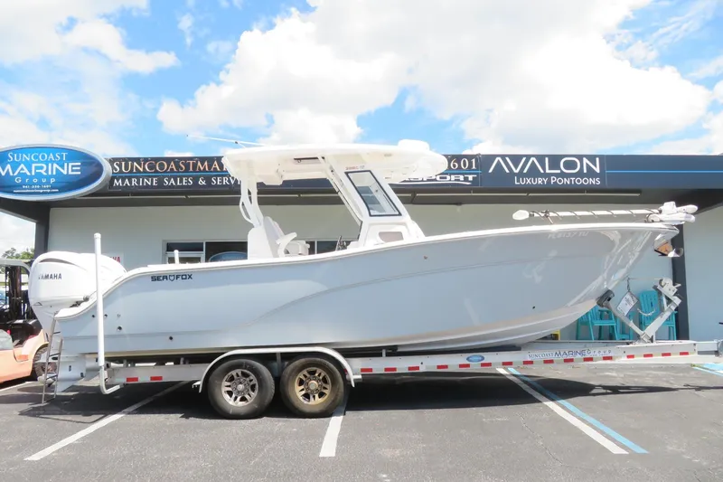Slide: The Image of 2024 Sea Fox 288 Commander boat covered on trailer at Suncoast Marine Group. - 1