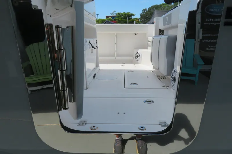 Slide: The Image of 2024 Sea Fox 288 Commander boat interior with seating and storage compartments. - 11