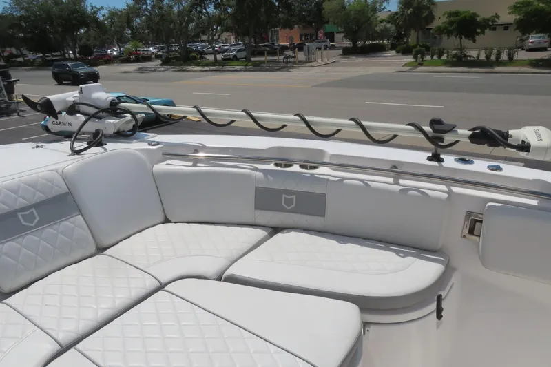 Slide: The Image of 2024 Sea Fox 288 Commander boat with white cushioned seating and Garmin equipment. - 13