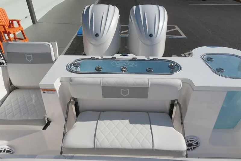 Slide: The Image of 2024 Sea Fox 288 Commander boat interior with seating and dual engines. - 22
