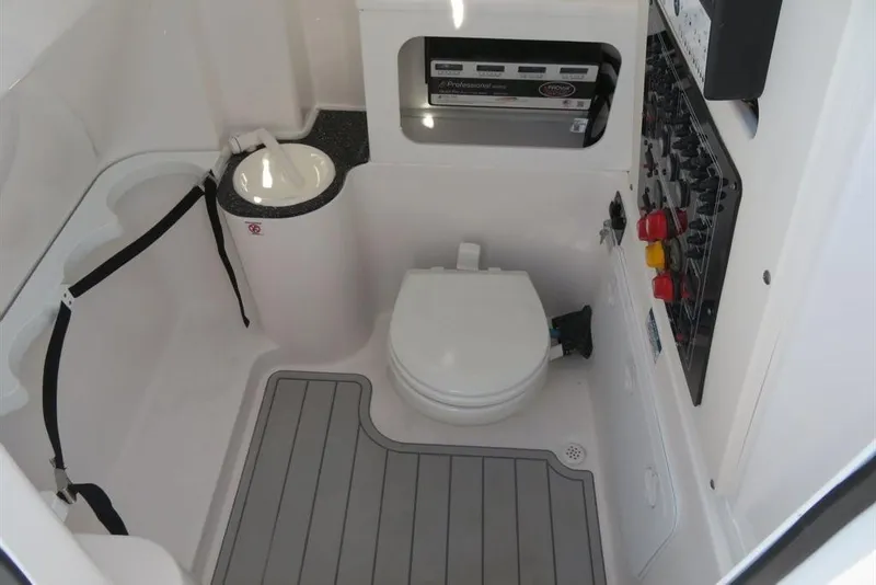 Slide: The Image of 2024 Sea Fox 288 Commander boat interior with toilet and control panel. - 23