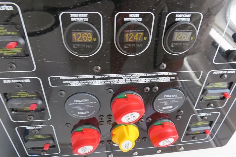 Slide: The Image of Control panel of a 2024 Sea Fox 288 Commander boat, displaying battery voltages. - 26