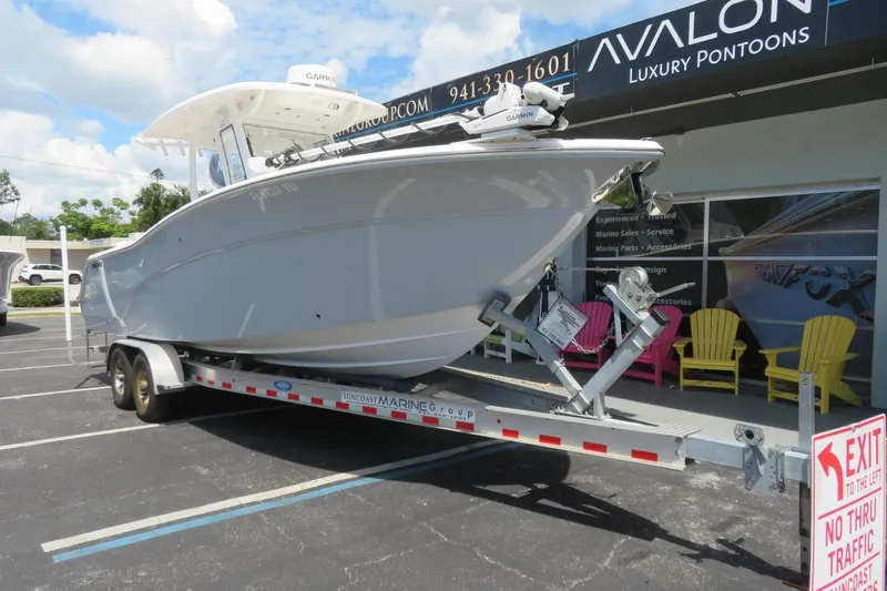 Slide: The Image of 2024 Sea Fox 288 Commander boat on trailer at Avalon Luxury Pontoons dealership. - 3