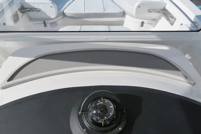 Slide: The Image of 2024 Sea Fox 288 Commander boat interior with compass and seating area. - 32