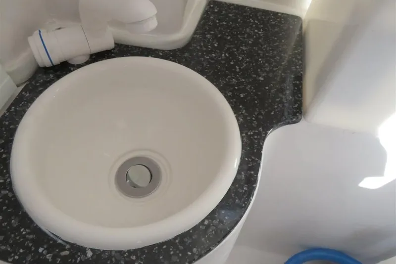 Slide: The Image of 2024 Sea Fox 288 Commander boat sink with speckled countertop. - 34