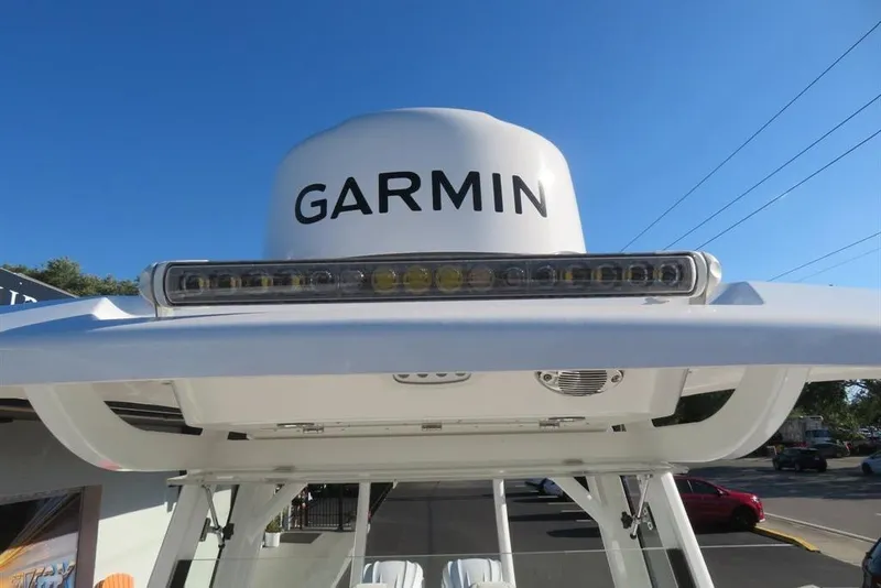 Slide: The Image of 2024 Sea Fox 288 Commander with Garmin radar, clear blue sky background. - 37