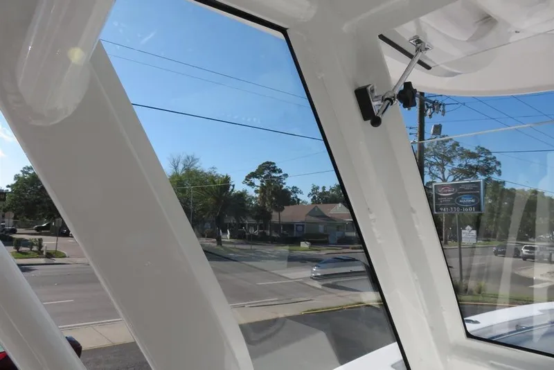Slide: The Image of Interior view of 2024 Sea Fox 288 Commander boat, showcasing window design and exterior street scene. - 39