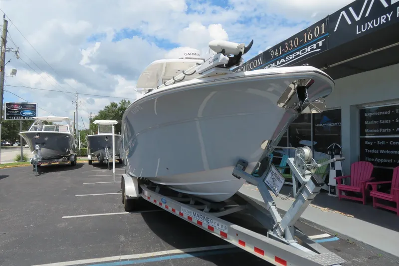 Slide: The Image of 2024 Sea Fox 288 Commander boat on trailer at dealership under cloudy sky. - 4