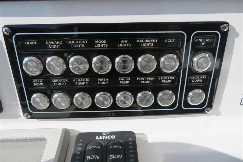 Slide: The Image of Control panel of 2024 Sea Fox 288 Commander boat with various switches and buttons. - 40