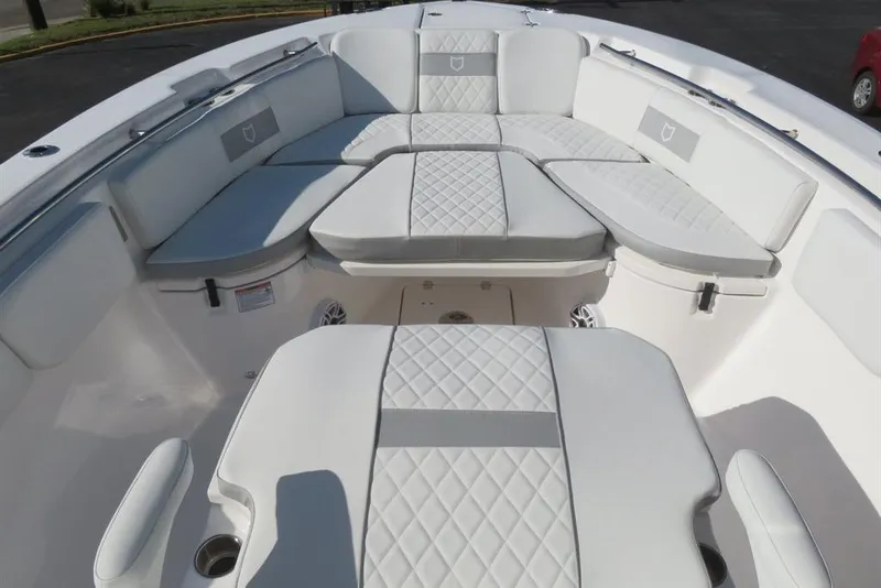 Slide: The Image of 2024 Sea Fox 288 Commander boat interior with luxurious seating and quilted upholstery. - 45