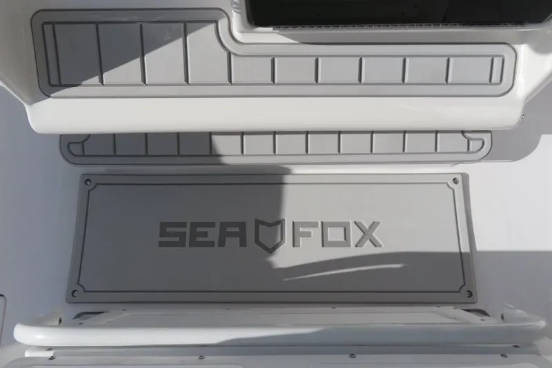 Slide: The Image of 2024 Sea Fox 288 Commander boat deck with logo and textured surface. - 46