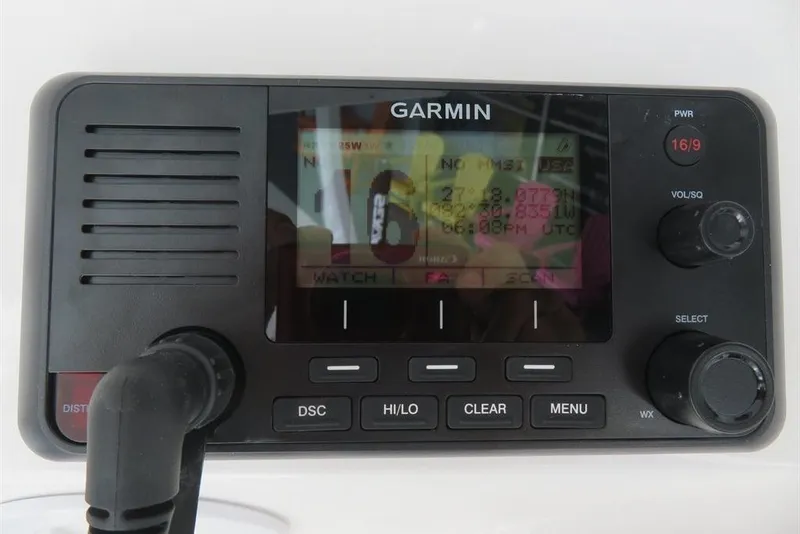 Slide: The Image of Garmin marine radio on 2024 Sea Fox 288 Commander boat dashboard. - 53