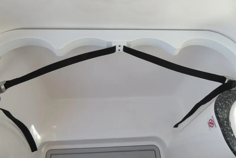 Slide: The Image of 2024 Sea Fox 288 Commander interior storage compartment with securing straps. - 55