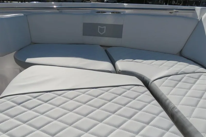 Slide: The Image of Luxurious seating on 2024 Sea Fox 288 Commander boat with quilted white upholstery. - 62