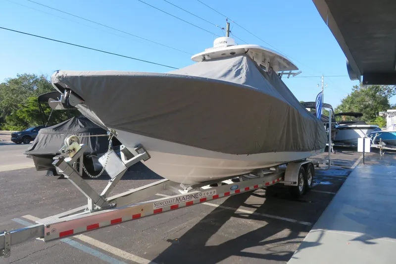Slide: The Image of 2024 Sea Fox 288 Commander boat covered on a trailer at a dealership. - 75