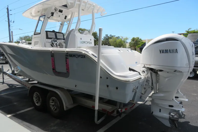 Slide: The Image of 2024 Sea Fox 288 Commander boat with Yamaha engine on trailer. - 8