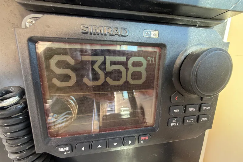 Slide: The Image of Simrad navigation display on 2006 Pursuit 3370 Offshore boat showing heading S 358. - 22