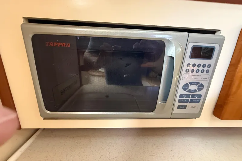 Slide: The Image of Built-in Tappan microwave in 2006 Pursuit 3370 Offshore boat kitchen. - 35