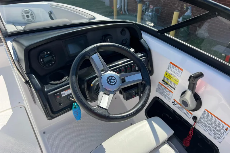 Slide: The Image of 2020 Yamaha Boats SX190 dashboard with steering wheel and control panel. - 17