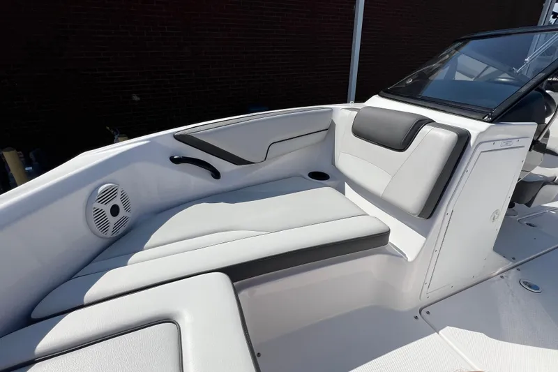 Slide: The Image of 2020 Yamaha SX190 boat interior with cushioned seating and speaker. - 20
