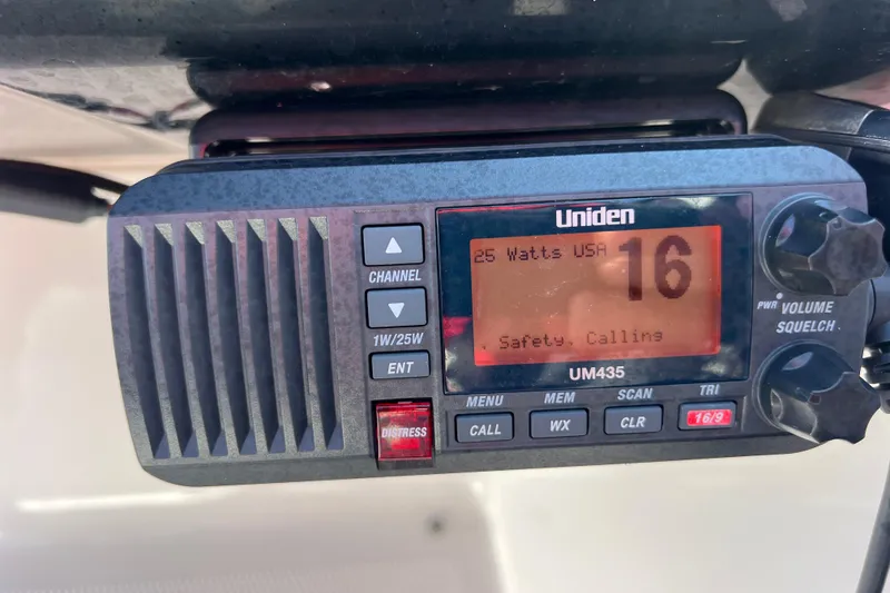 Slide: The Image of Uniden UM435 marine radio on 2020 Yamaha SX190, displaying channel 16 for safety calling. - 23