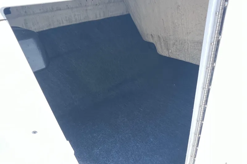 Slide: The Image of Storage compartment of a 2020 Yamaha Boats SX190, featuring a spacious interior. - 30