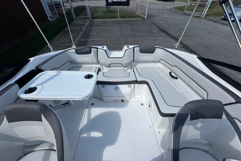 Slide: The Image of 2020 Yamaha Boats SX190 interior with seating and table, showcasing modern design and comfort. - 33