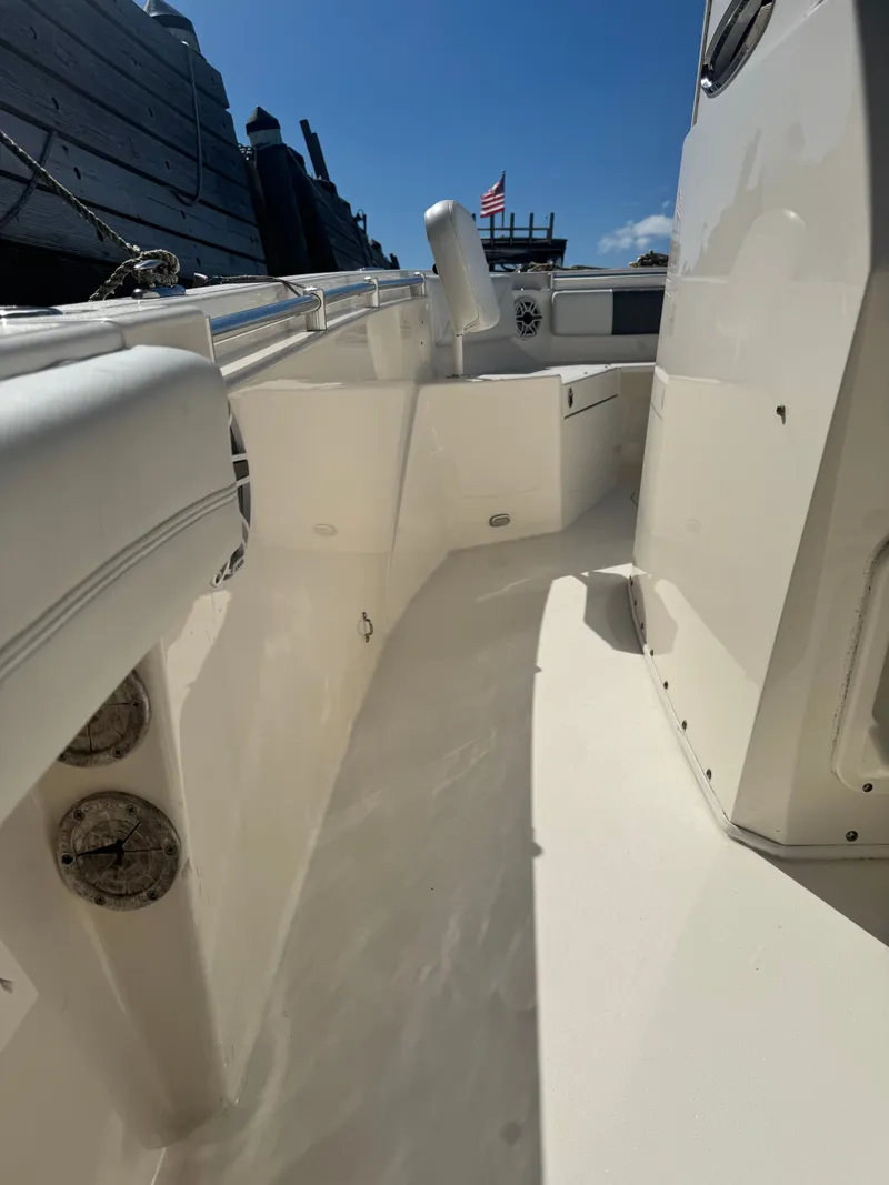 Slide: The Image of 2020 Cobia 240 Center Console boat interior with American flag in background. - 19