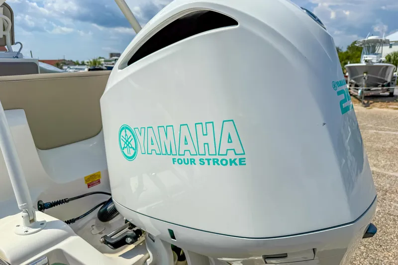 Slide: The Image of Yamaha four-stroke engine on 2021 Key West 239 FS boat, outdoor setting. - 13