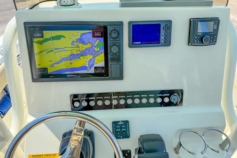 Slide: The Image of 2021 Key West 239 FS boat dashboard with Garmin navigation system and controls. - 14