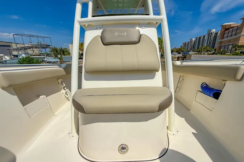 Slide: The Image of 2021 Key West 239 FS boat interior with cushioned seating and storage compartments. - 28