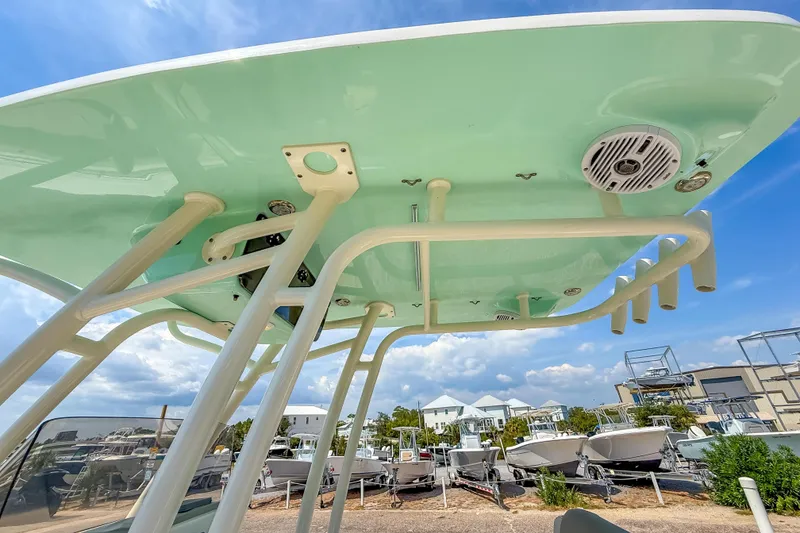 Slide: The Image of 2021 Key West 239 FS boat top view with rod holders and speakers. - 29