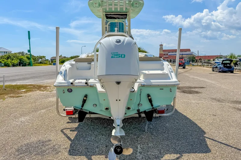 Slide: The Image of 2021 Key West 239 FS boat with Yamaha 250 engine, parked on a sunny day. - 9