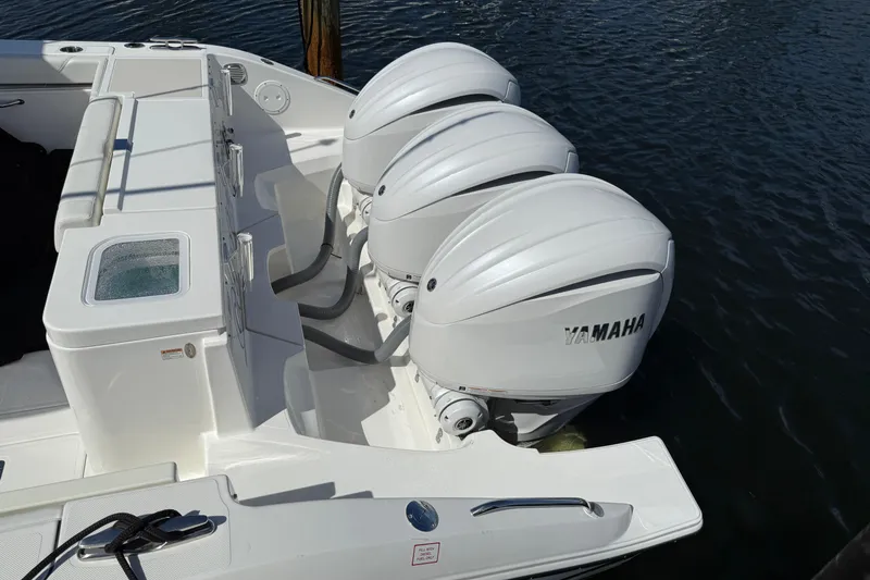 Slide: The Image of 2023 Pursuit OS 355 Offshore boat with triple Yamaha outboard engines. - 17